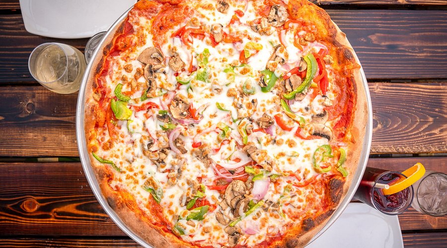 Wild Tomato signature dishes The Fun Guy Pizza, Green and Gold Pizza, D-Lux Pizza, Cheese Curds